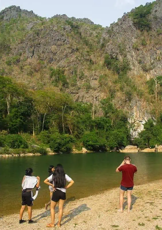 swimming with some locals in the river at kong lor laos