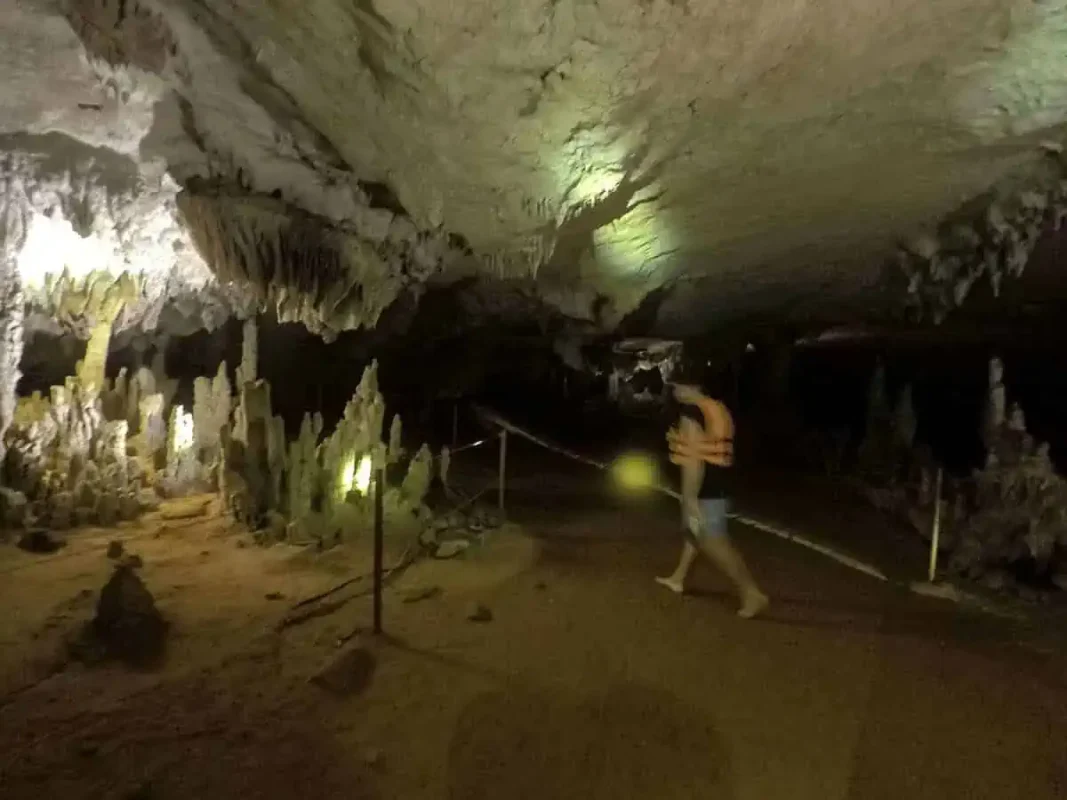 walking through the kong lor hike section of the cave, in reality its only a five to ten minute walk