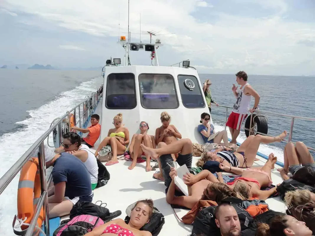 travelers relaxing on the ferry to koh phi phi