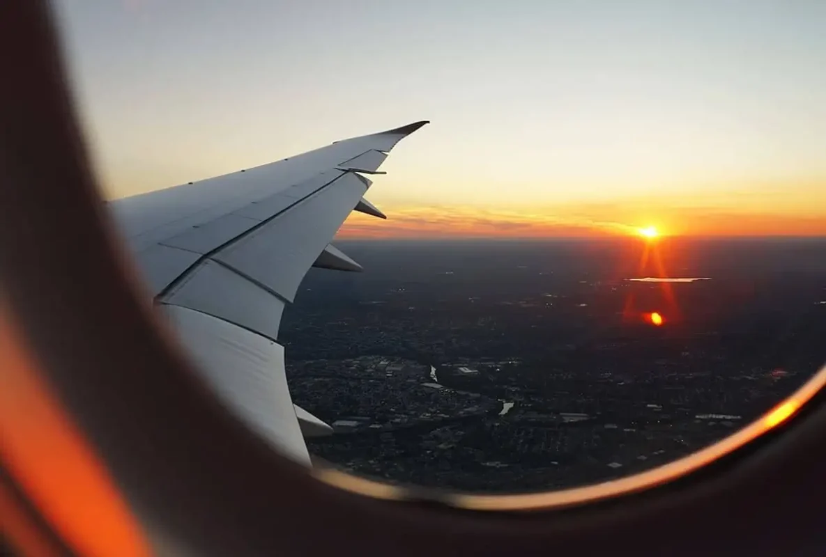 sunset from plane window over laos