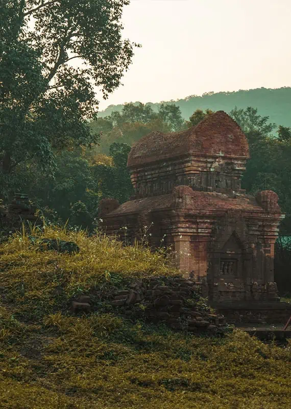 My Son Sanctuary Hoi An: BEST Tips & Tours (2025) 23 looking over a hill to a temple at my son sanctuary vietnam