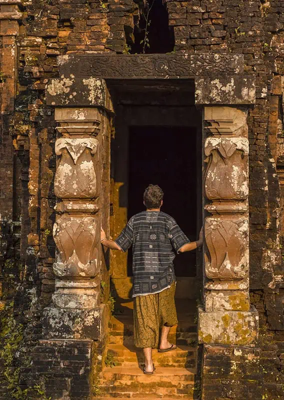 My Son Sanctuary Hoi An: BEST Tips & Tours (2025) 26 a man exploring the interior of one of the temples at my son sanctuary