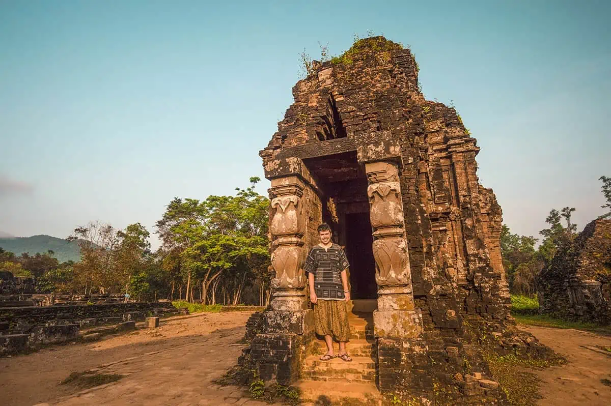 My Son Sanctuary Hoi An: BEST Tips & Tours (2025) 21 a man in front of one of the temples at my son sanctuary