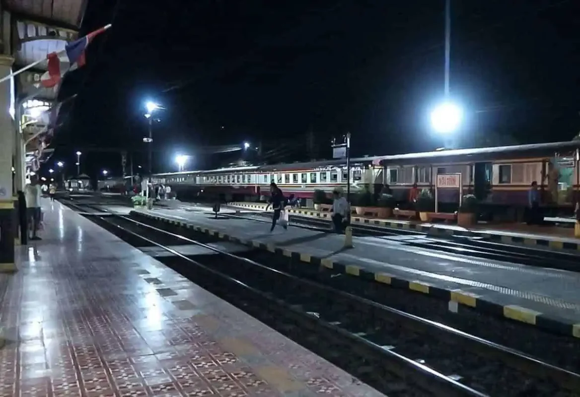 Passengers waiting at the station to board the overnight sleeper train from Bangkok to Chiang Mai.