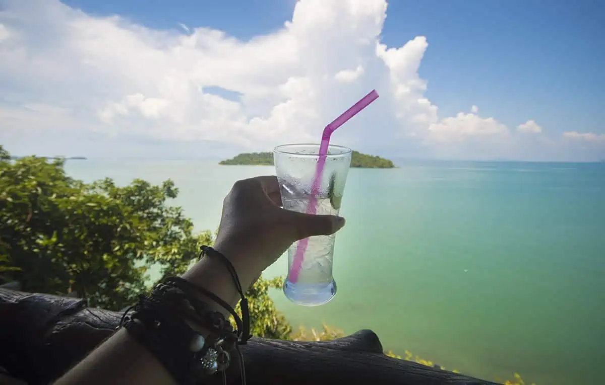 enjoying a cold drink by the ocean in koh lanta
