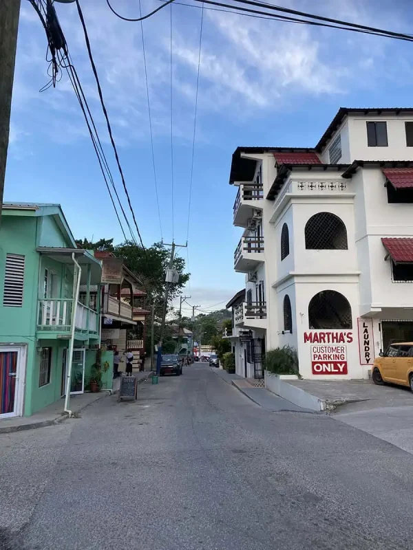 The quaint streets of San Ignacio town with pastel-colored buildings, setting off for an early morning journey to Tikal.