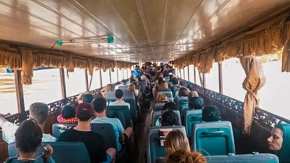 Passengers seated inside the slow boat to Luang Prabang