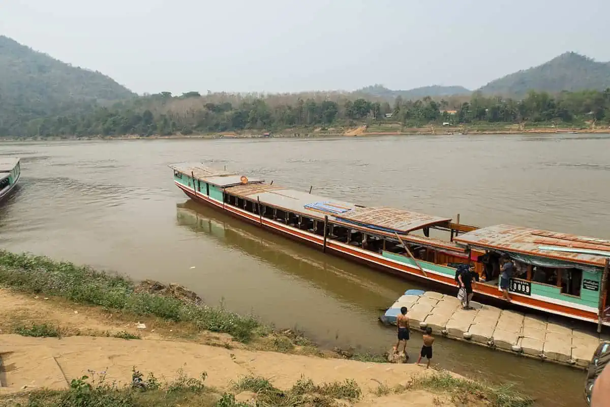 Boats moored up at Luang Prabang with passengers disembarking.