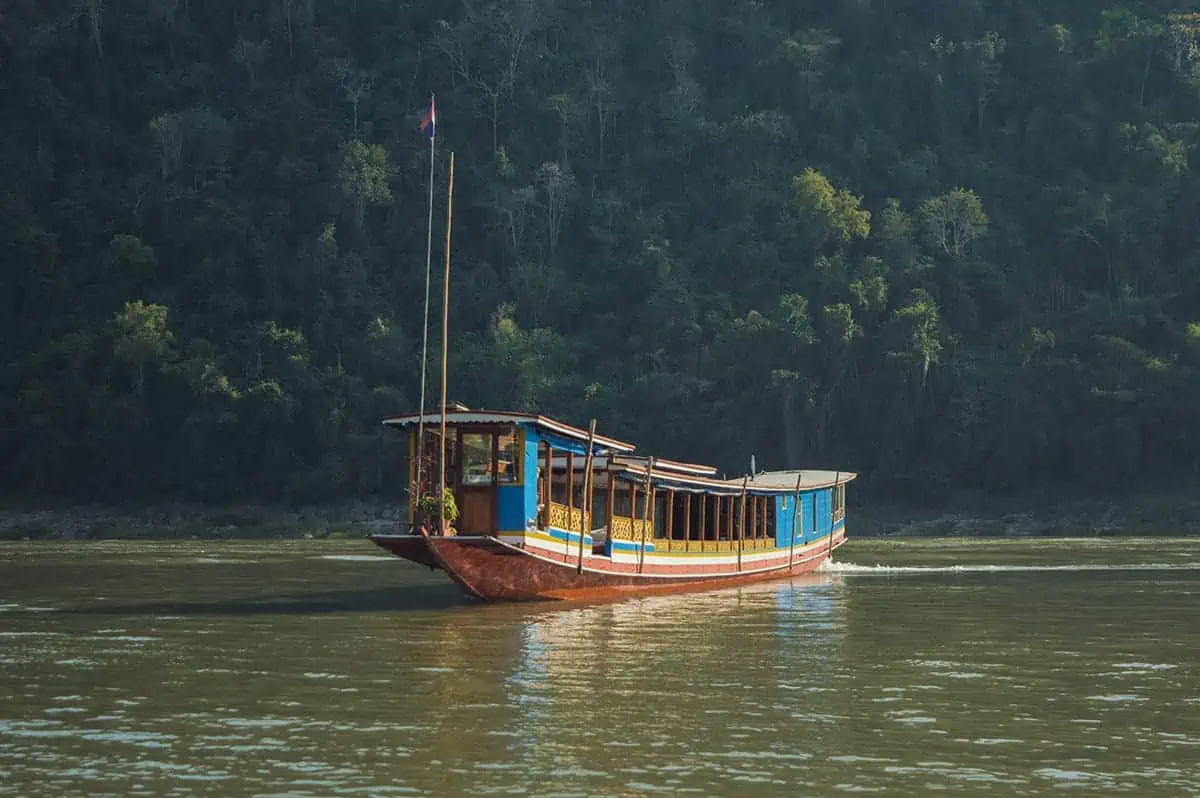 A slow boat to Luang Prabang gliding along the Mekong River