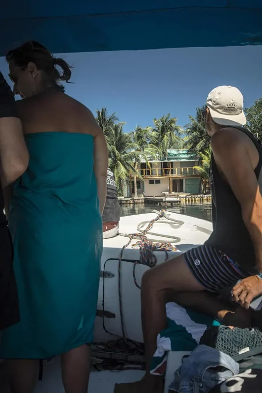 people on a boat in search of the local crocodile in caye caulker