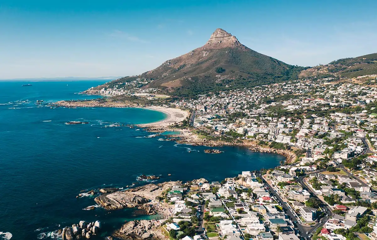 An aerial view showcasing the breathtaking beauty of Cape Town and Table Mountain - a must-visit destination for backpackers seeking unforgettable experiences.
