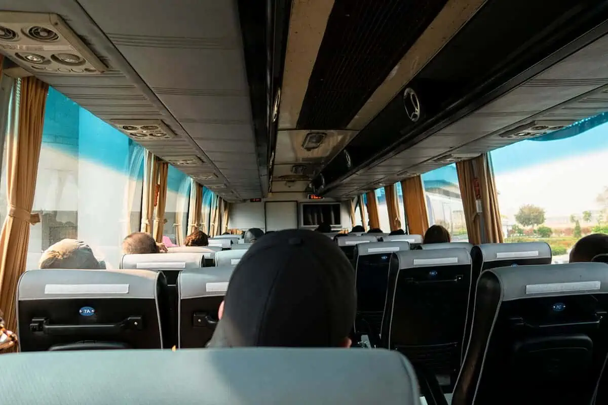 taking the bus across the thai laos friendship bridge on the thailand laos border crossing