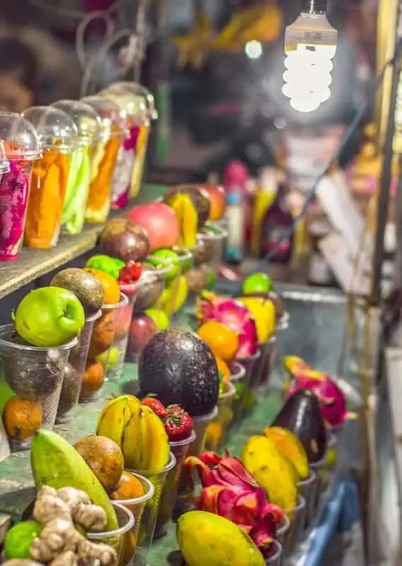 3 Days In Luang Prabang Itinerary: ULTIMATE Guide 11 delicious glasses of fruit waiting to be made into smoothies at the luang prabang night market