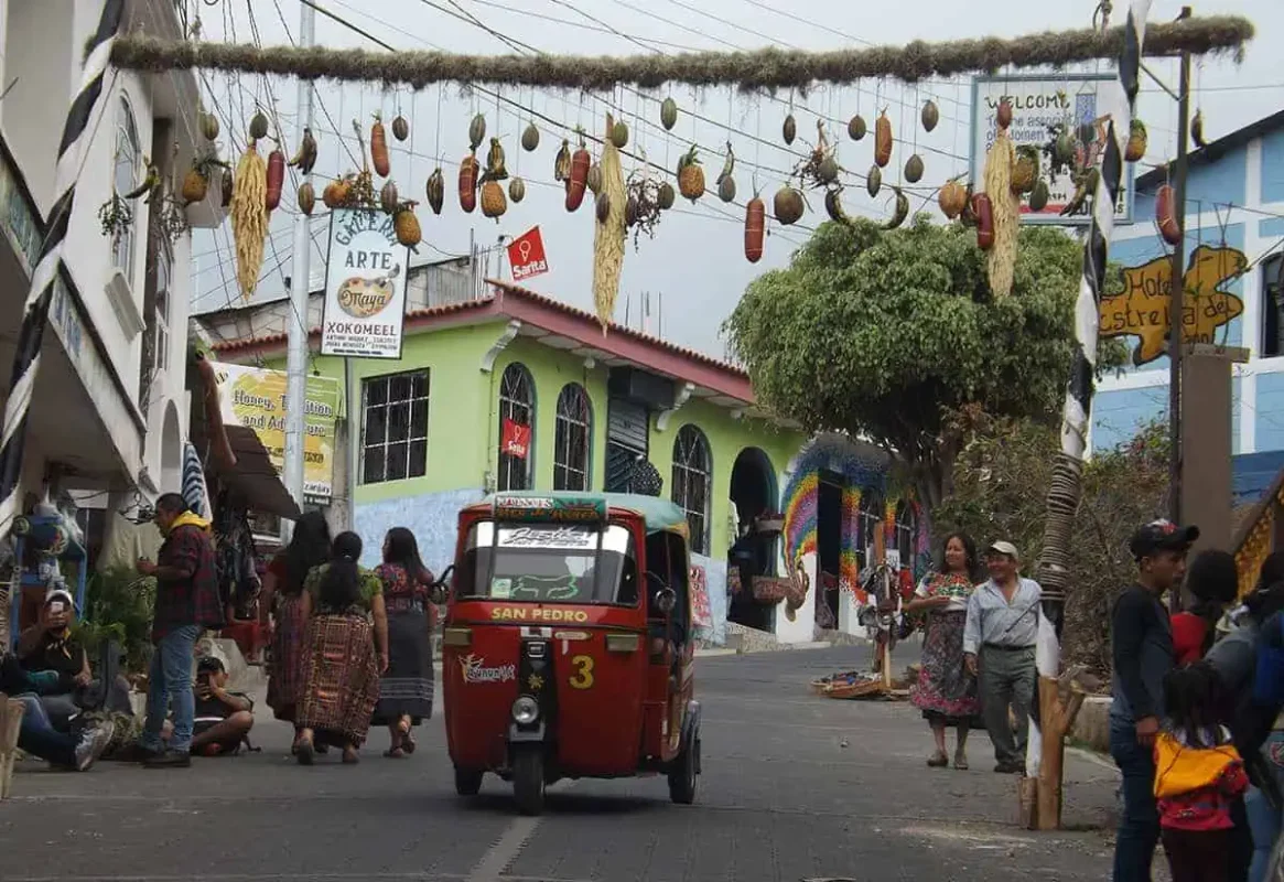 Panajachel To San Pedro & The Towns Between: How To Travel Around Lake Atitlan 21 life along the main street at san juan la laguana
