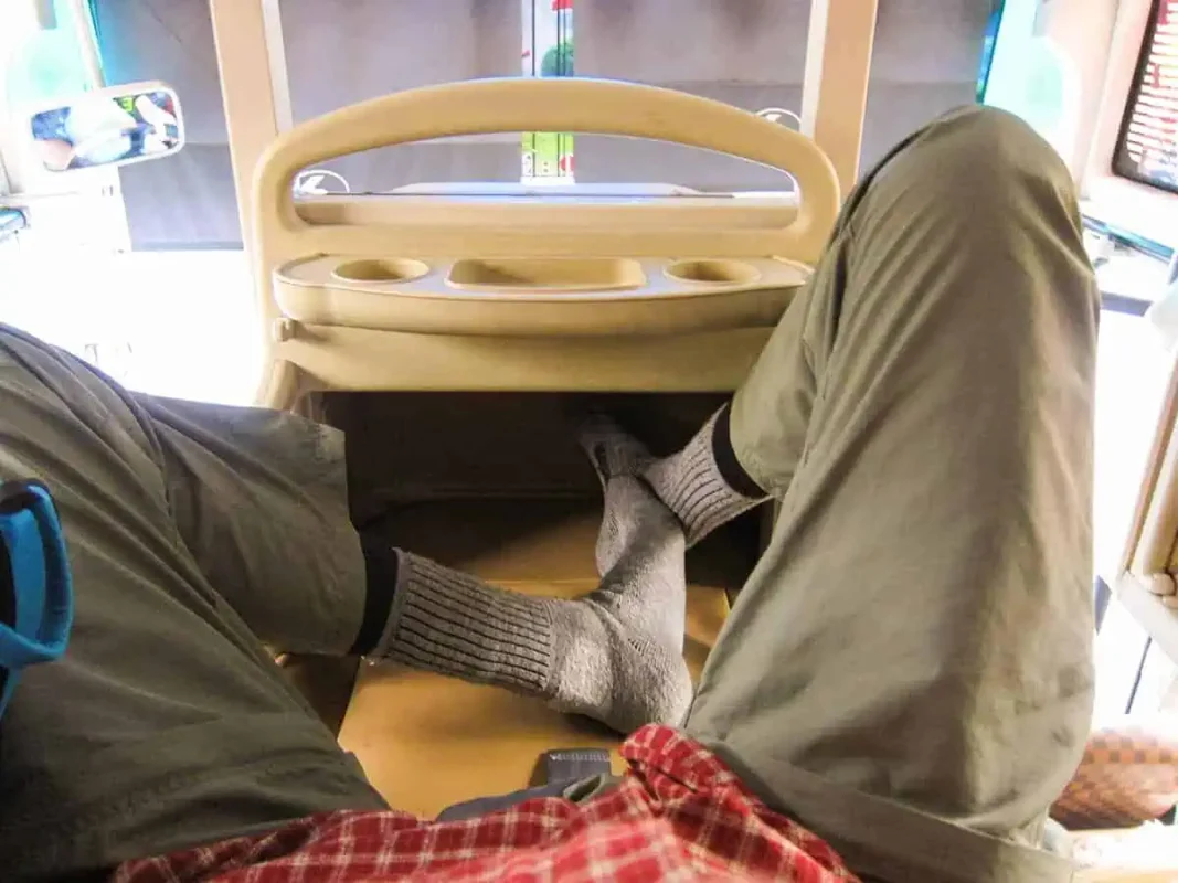 Taking A Vietnam Sleeper Bus: BEST Tips For Travelers 2025 6 First-person view inside a sleeper bus compartment in Vietnam