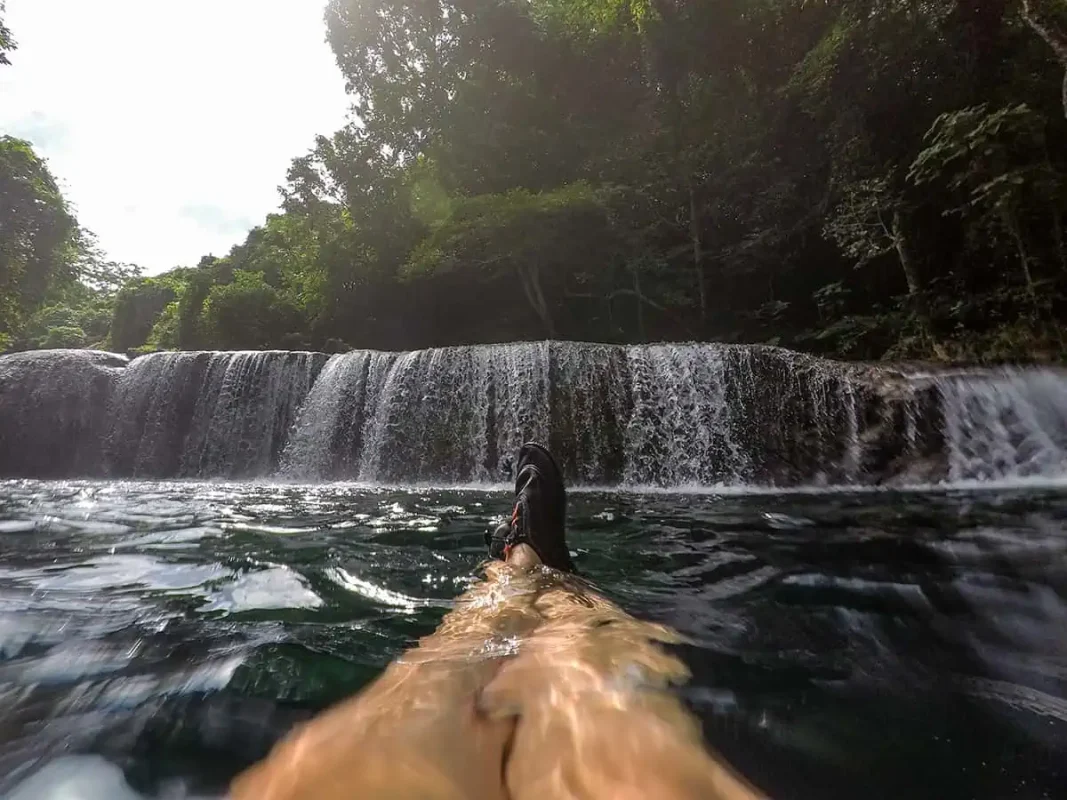 looking down at my watershoes while in front of rarru cascades in port vila