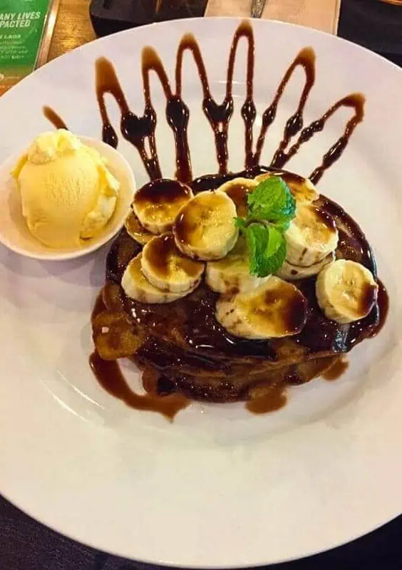 fresh banana and chocolate pancakes with a side of ice cream from saffron coffee