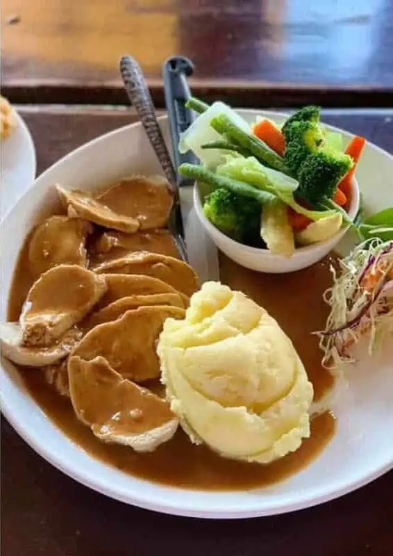 western food from garys irish pub where to eat in vang vieng consisting of a roast with gravy