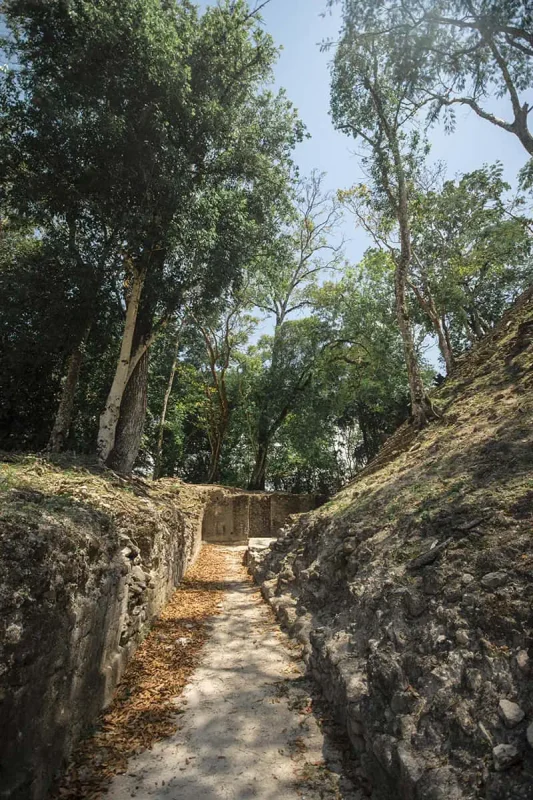 Why Visit Belize: 20 Reasons To Add It To Your Travel Bucketlist 7 exploring the many walkways around the cahal pech mayan ruins